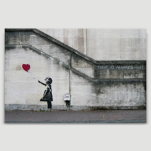 Banksy canvas home wall art featuring his work Girl With Balloon there is always hope hanging on a beige wall. 