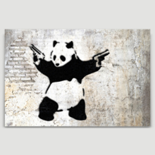 Banksy canvas home wall art featuring his work Panda With Guns Stick Em Up hanging on a beige wall.