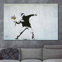 Banksy canvas wall art print of his famous work Rage The Flower Thrower love is in the air in a modern living room.